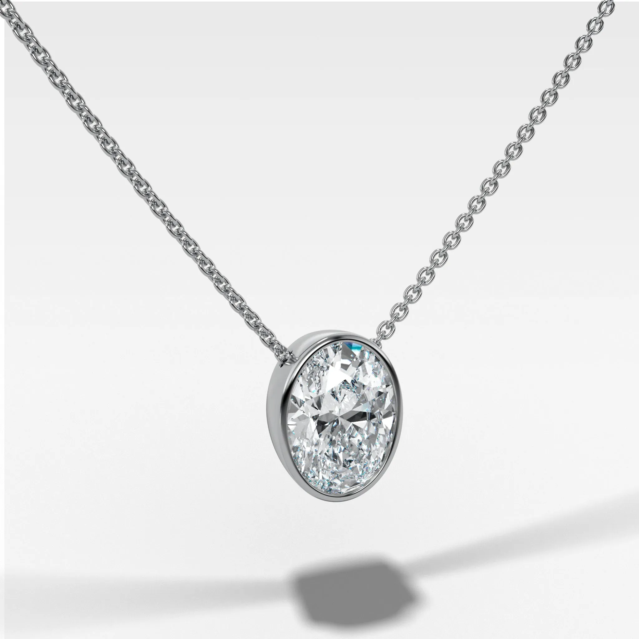 Bezel Pendant Necklace with an Oval Cut Diamond