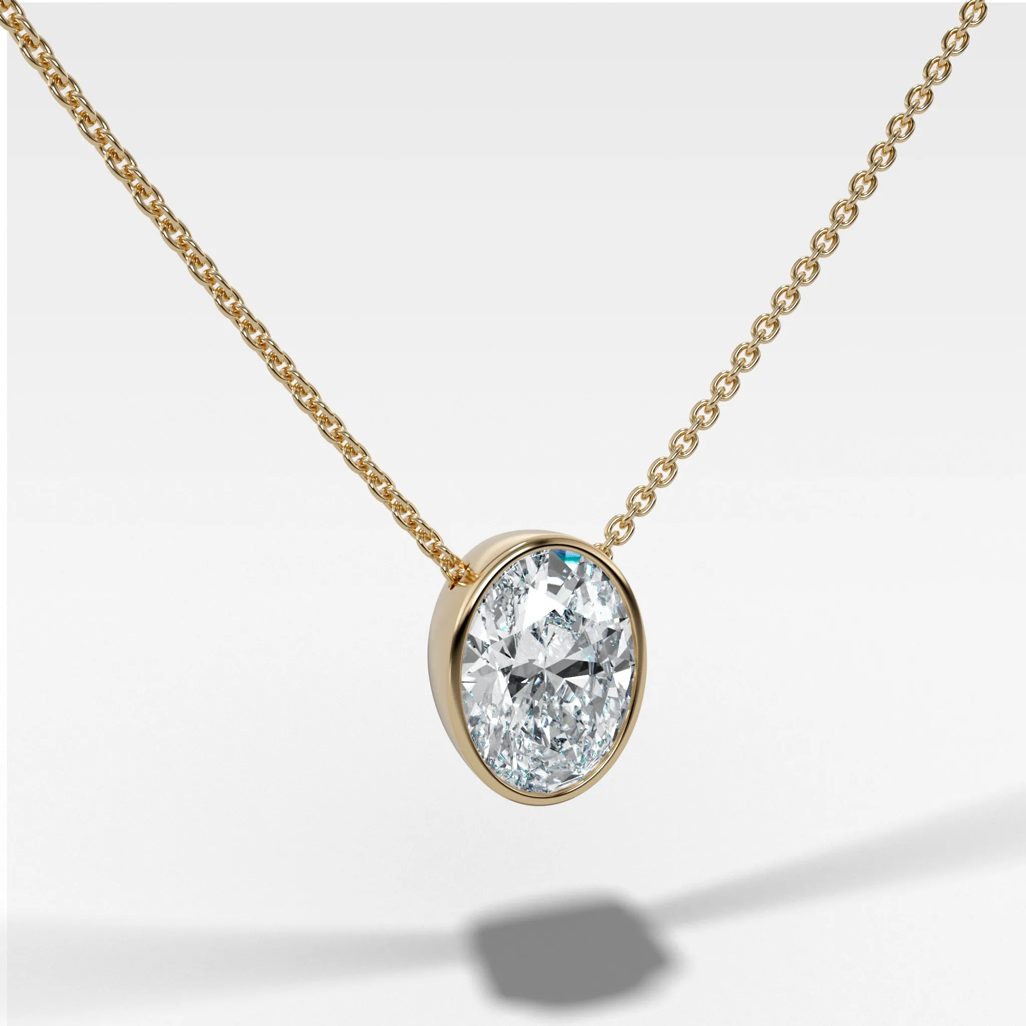 Bezel Pendant Necklace with an Oval Cut Diamond