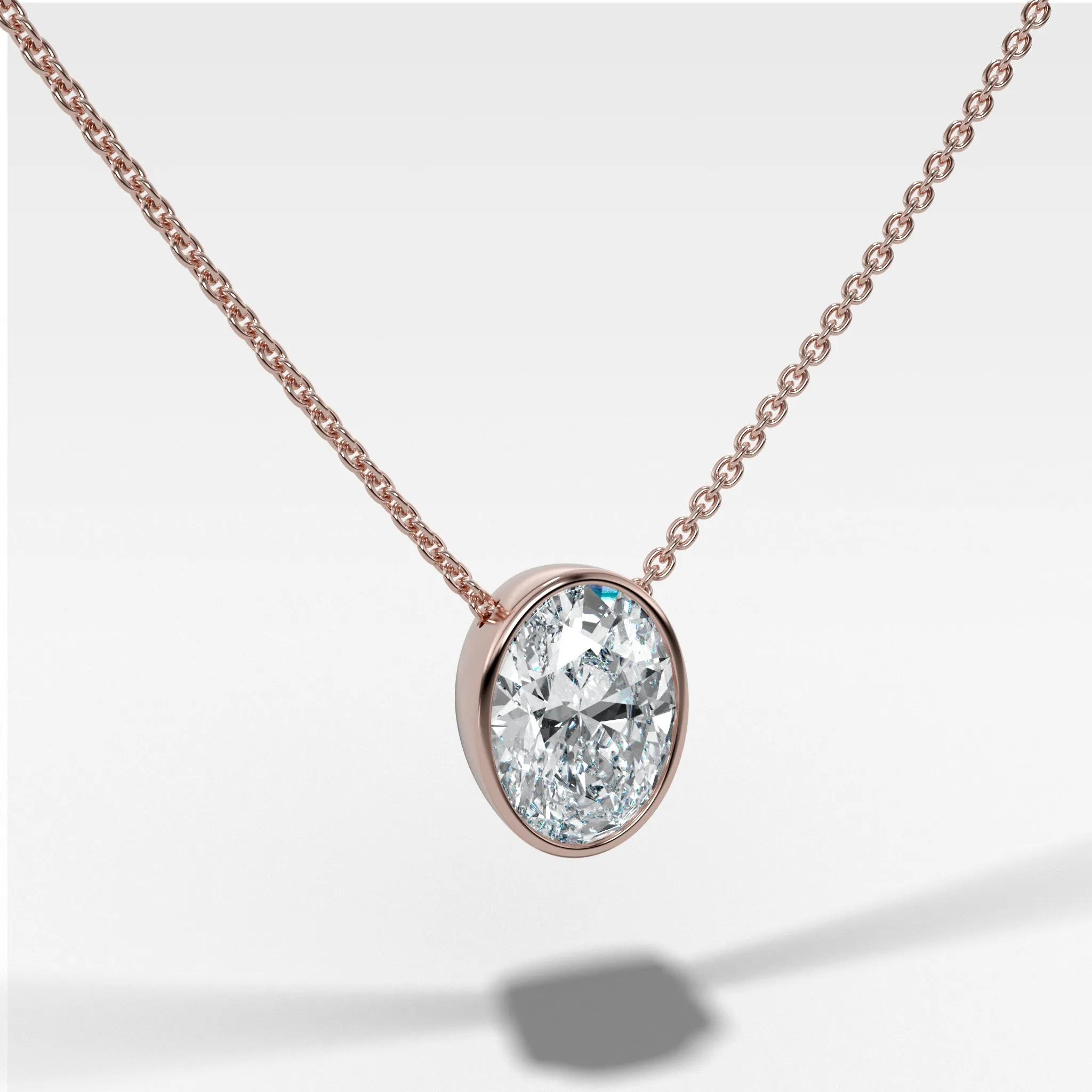 Bezel Pendant Necklace with an Oval Cut Diamond