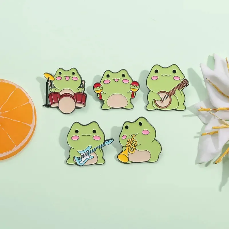 Kawaii Cartoon Frog Band Enamel Pins 🎶🐸 | Fun Drum & Guitar Brooches for Kids & Friends 🎸✨ | Cute Lapel Badges & Jewelry Gift